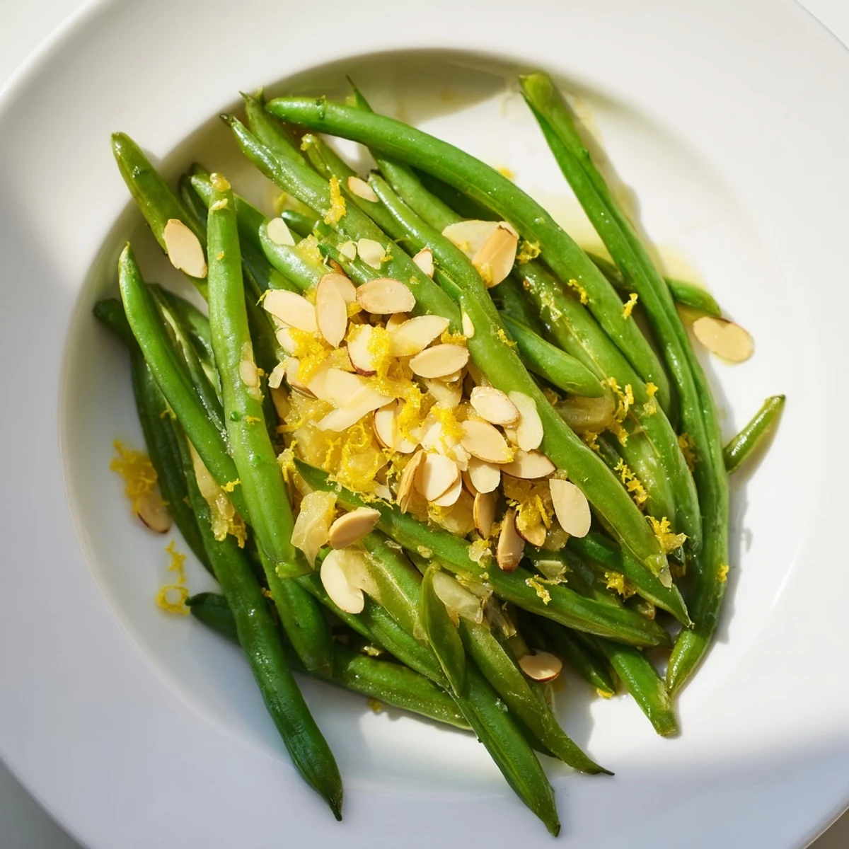 A bright side dish featuring crisp beans, crunchy almonds, and citrusy lemon notes.