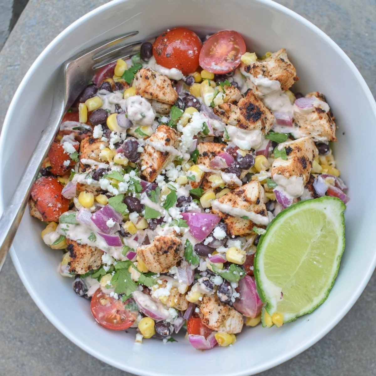 Succulent diced grilled chicken served over sweet corn, tomatoes, and beans in zesty Greek yogurt dressed salad