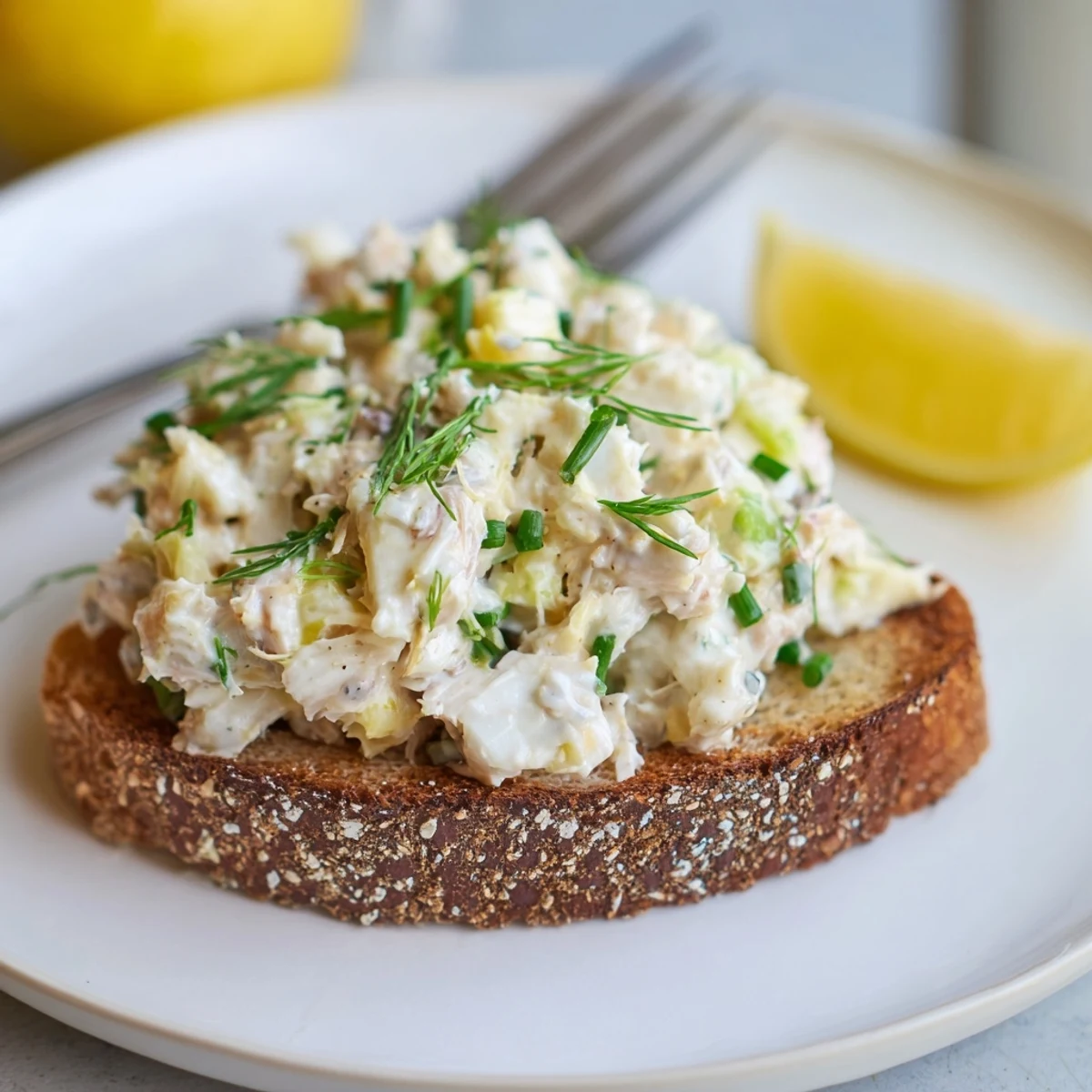 Crispy buttered toast topped with lump crab meat mixture and garnished with herbs