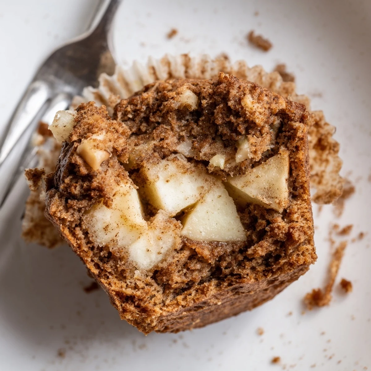 Plated Healthy Apple Cinnamon Greek Yogurt Muffins served with honey drizzle and walnut sprinkle