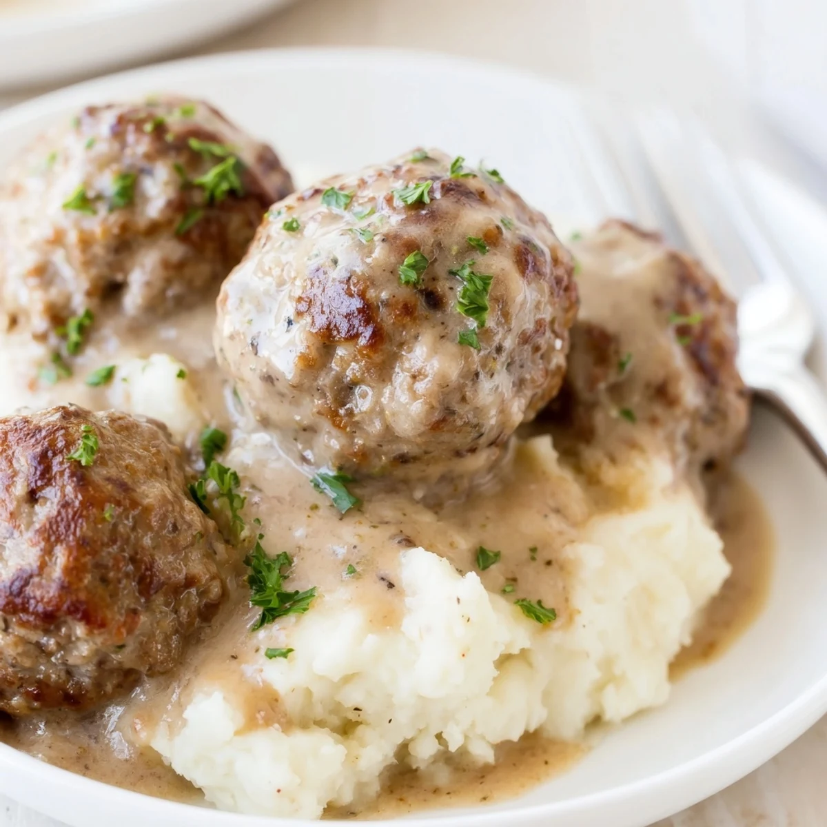 Hearty Crockpot Meatballs Gravy bubbling in slow cooker, rich mushroom aroma.