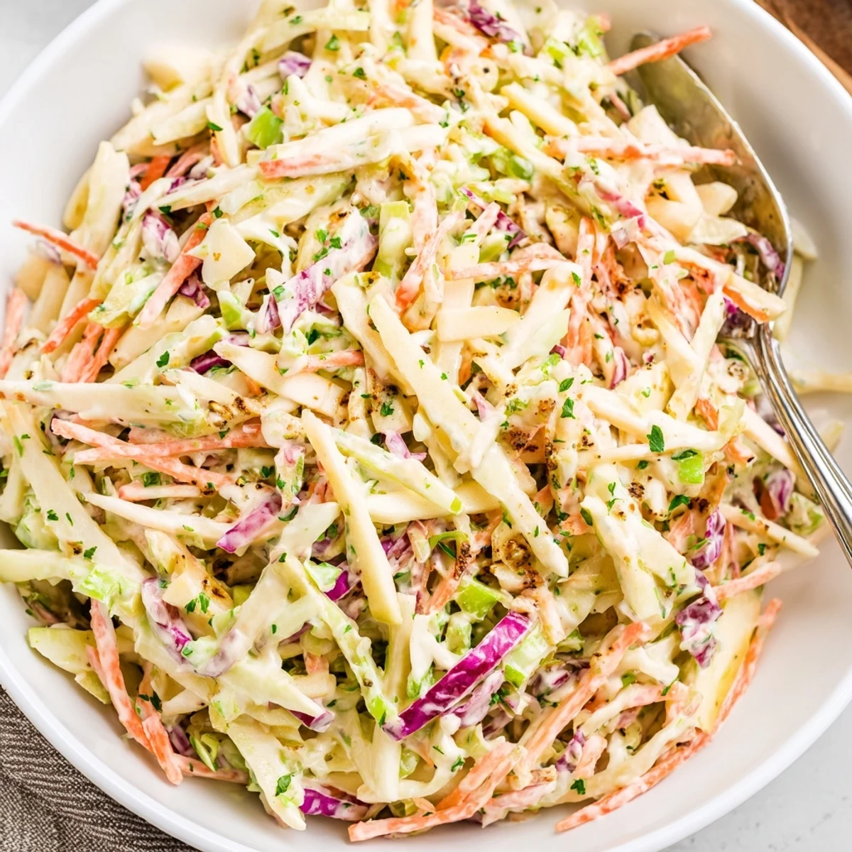Apple Coleslaw with crunchy cabbage and tart apple matchsticks, picnic-ready side