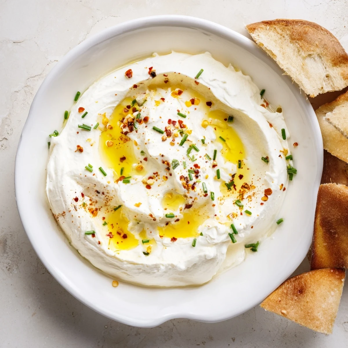 Whipped feta dip finished with spicy sweet honey and served with crusty bread