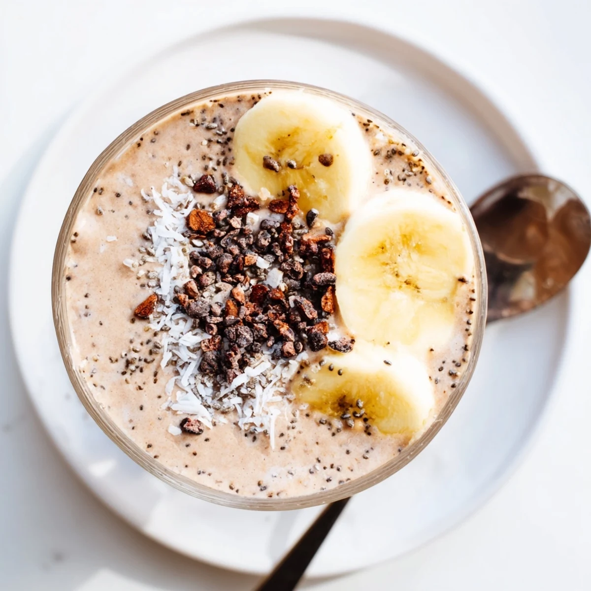 Velvety Raw Chocolate Banana Shake in chilled glass, rich cocoa aroma