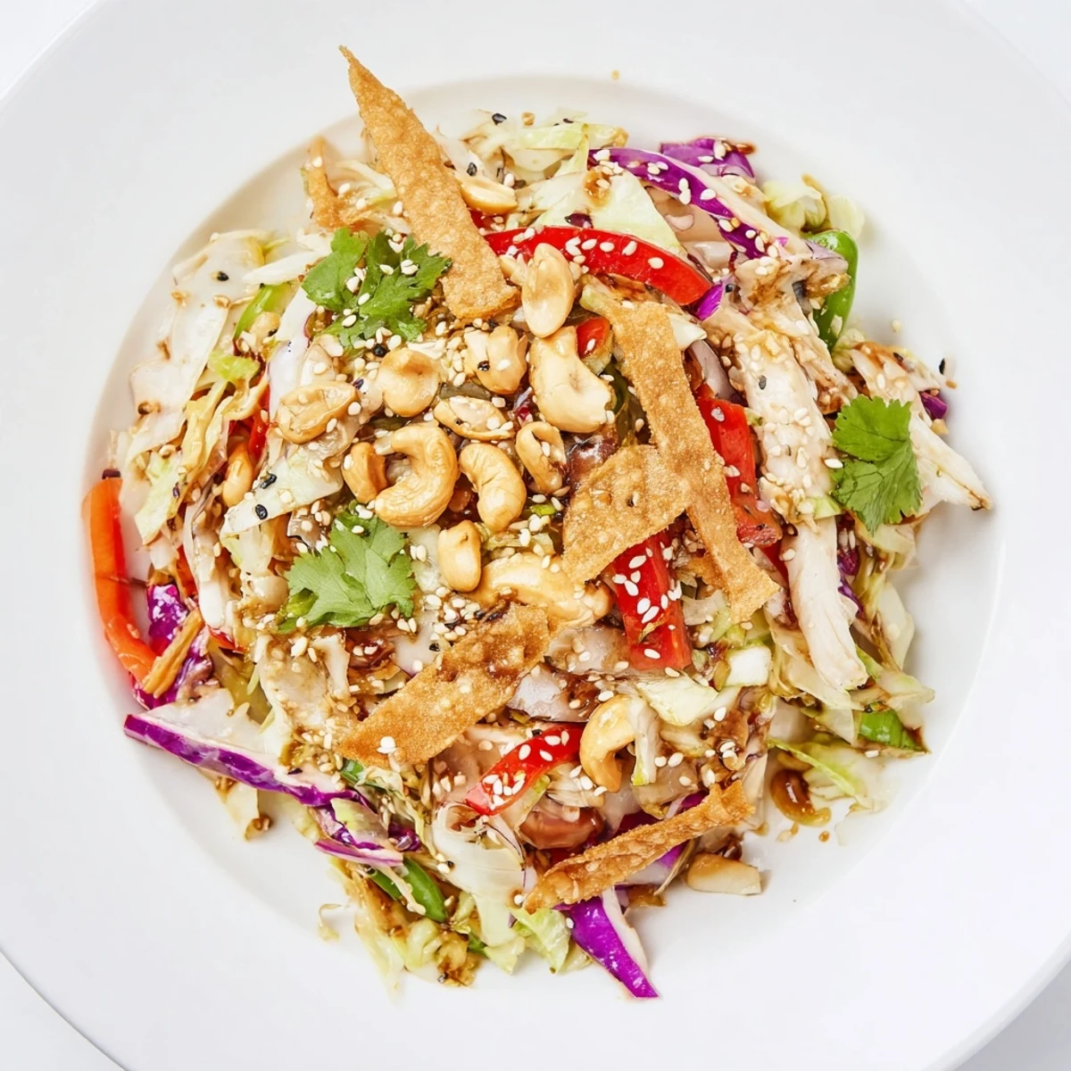 Colorful chicken cashew crunch salad tossed with crisp vegetables in a sesame-soy dressing
