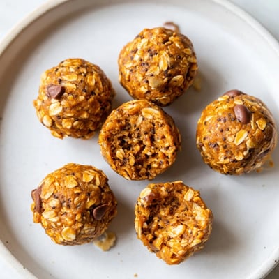Chewy no bake pumpkin protein balls studded with chocolate chips and warm spices