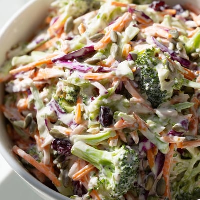 Crisp broccoli slaw tossed with colorful vegetables and creamy mayo dressing